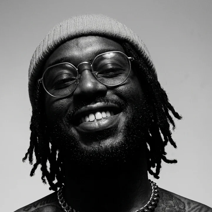 Malcolm Xavier, black-and-white portrait